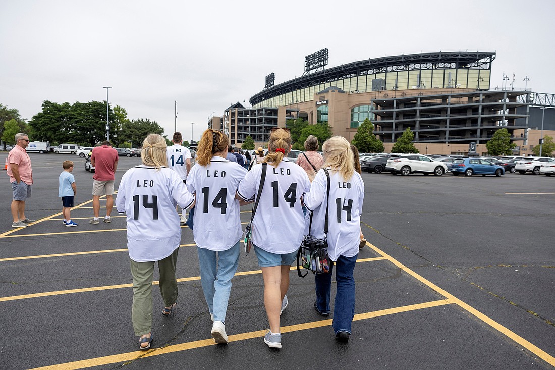 A family arrives ahead a June 14, 2025, Mass in honor of Pope Leo XIV at Rate Field in Chicago, home of the Chicago White Sox baseball team. The Chicago-born pontiff, elected May 8, is the first American pope in history. (OSV News photo/Carlos Osorio, Reuters)