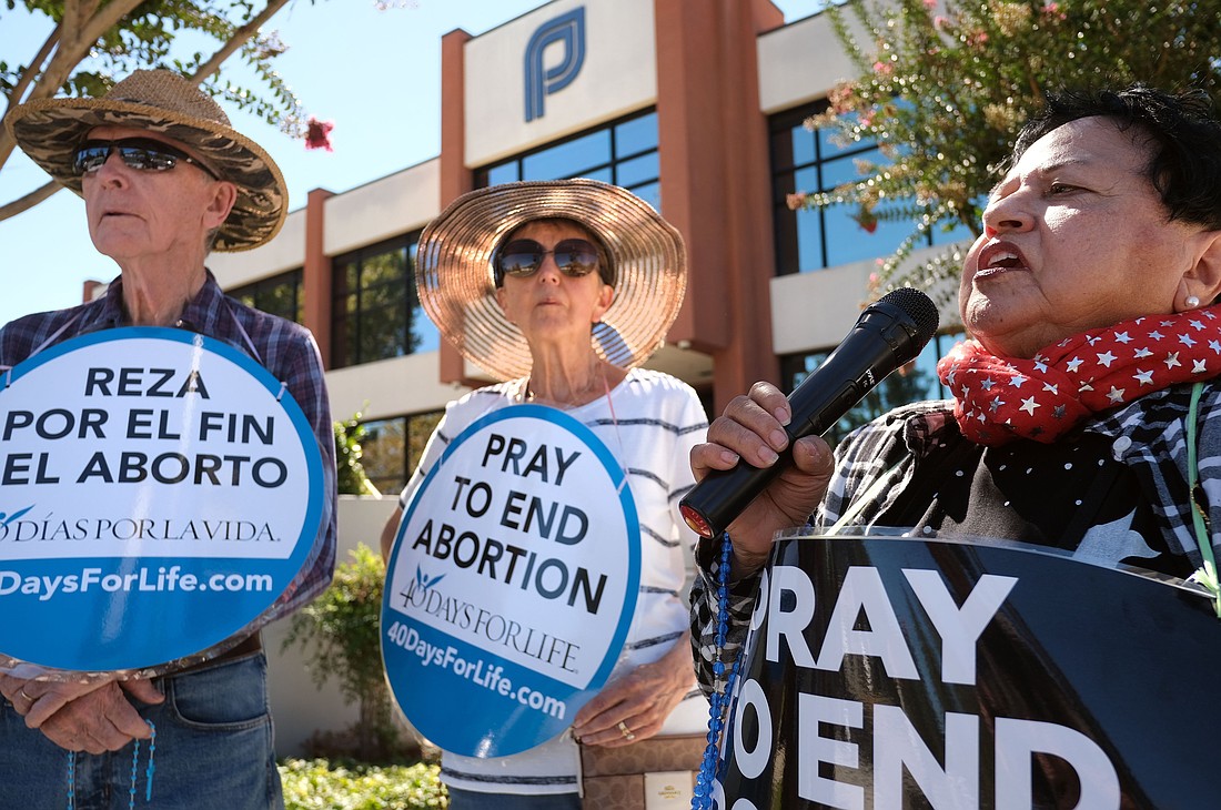 People in San Jose, Calif., participate in a recitation of the rosary outside a Planned Parenthood facility Sept. 28, 2022. The gathering was held on the first day of the 40 Days For Life nationwide campaign, which calls for peaceful protests for 40 days outside abortion facilities. (OSV News photo/CNS file, David Maung)