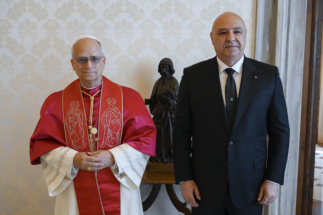 Pope Leo XIV poses for a photo with President Joseph Aoun of Lebanon in the library of the Apostolic Palace at the Vatican June 13, 2025. (CNS photo/Vatican Media)