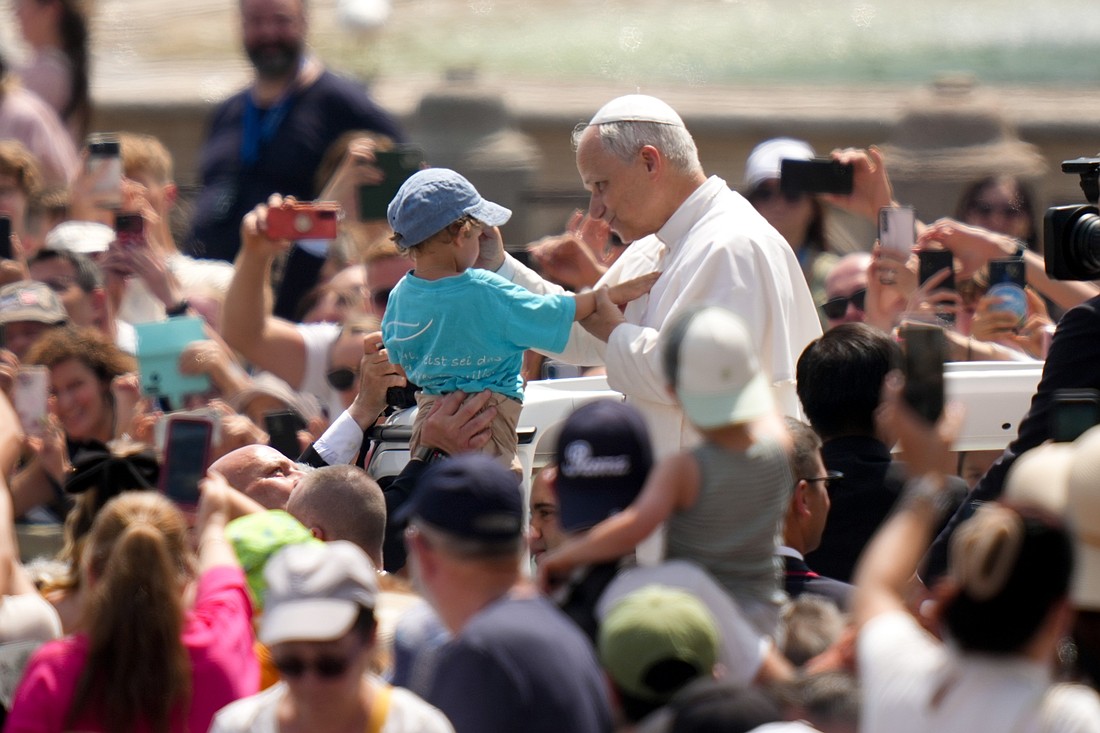 Pope Leo XIV greets people as he rides in the popemobile in St. Peter’s Square after celebrating Mass on the feast of the Holy Trinity and for the conclusion of the Jubilee of Sport in St. Peter’s Basilica at the Vatican June 15, 2025. (CNS photo/Lola Gomez)