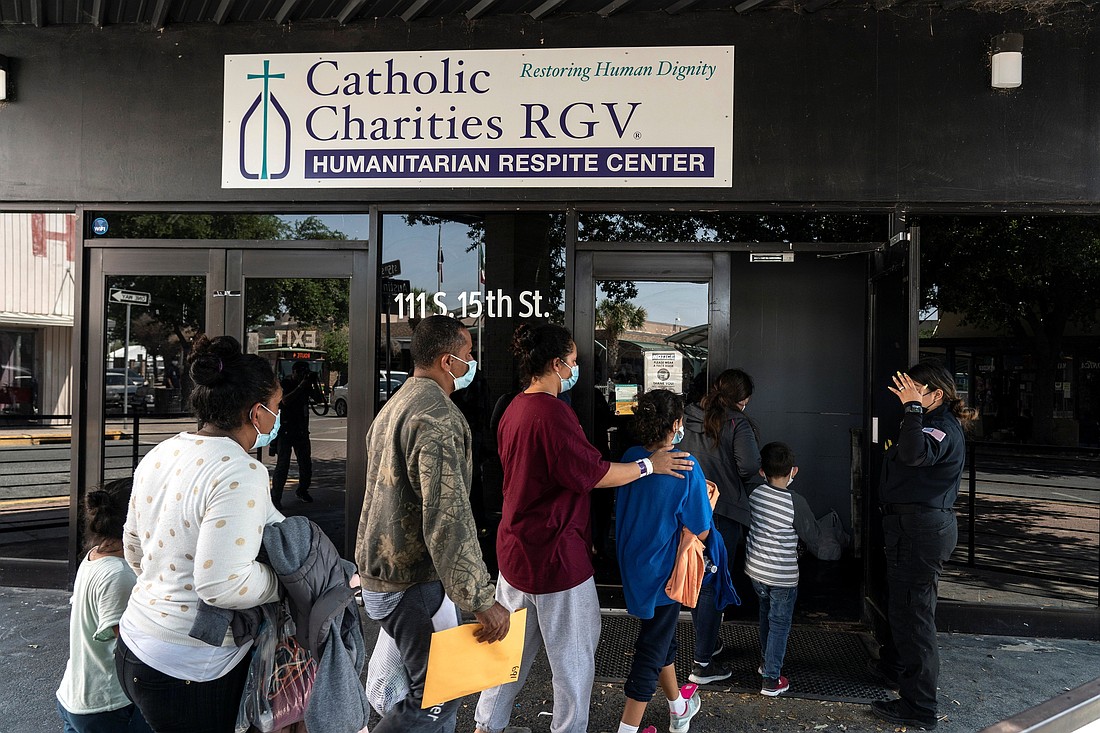 Migrants seeking asylum in the U.S. walk into a temporary humanitarian respite center run by Catholic Charities of the Rio Grande Valley in McAllen, Texas, April 8, 2021. Catholic Charities USA and the U.S. Conference of Catholic Bishops are among more than 200 NGOs named in a congressional probe, announced June 11, 2025, seeking to investigate aid to migrants its leaders call "inadmissible aliens" during former President Joe Biden's administration. (OSV News photo/Go Nakamura, Reuters)