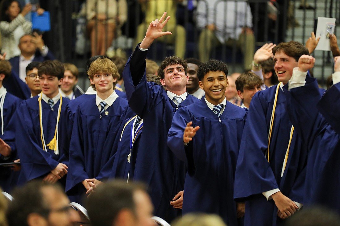 John Havens and Abraham Hernandez smile and wave at family and friends May 22 during their Commencement exercises at Brookdale Community College, Lincroft. Larry Levanti/CBA courtesy photo