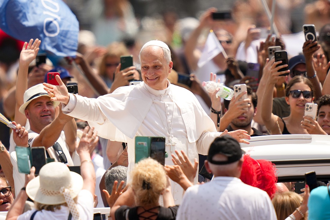 Pope Leo XIV greets people as he rides in the popemobile in St. Peter’s Square after celebrating Mass on the feast of the Holy Trinity and for the conclusion of the Jubilee of Sport in St. Peter’s Basilica at the Vatican June 15, 2025. (CNS photo/Lola Gomez)