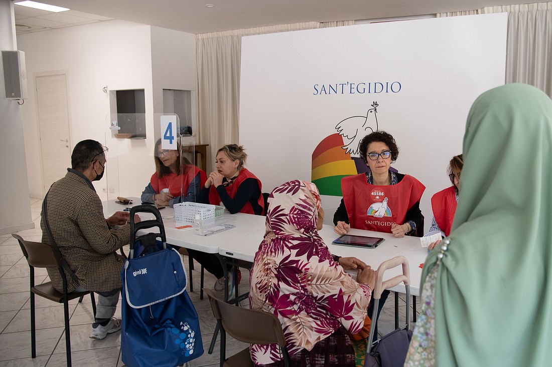 Refugees from different countries register for classes in the Italian language and culture at a Sant'Egidio Community center in Rome in this file photo. (CNS photo/courtesy Community of Sant'Egidio)