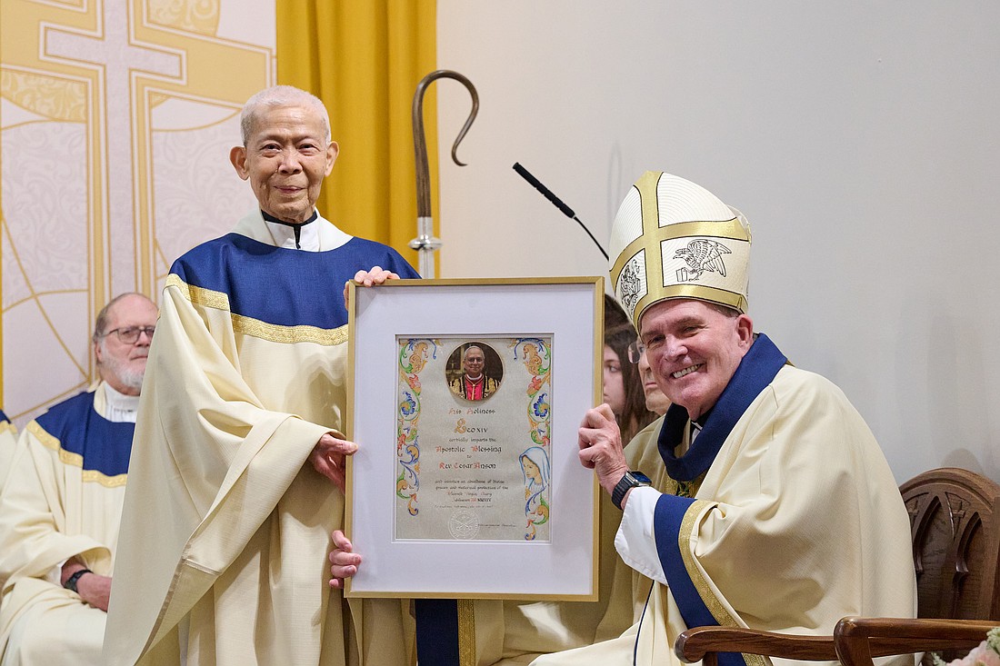 Bishop David M. O’Connell, C.M., joined the community of Mary, Mother of the Church Parish, Bordentown, where he celebrated a Mass for the parish feast day on June 9. During the Mass the Bishop presented papal blessings to four individuals, including Father Cesar Anson, shown here. The July issue of The Monitor Magazine will include a feature on happenings taking place in parishes such as feast day and anniversary celebrations. Look for the next issue set to come out around July 8. Mike Ehrmann photo