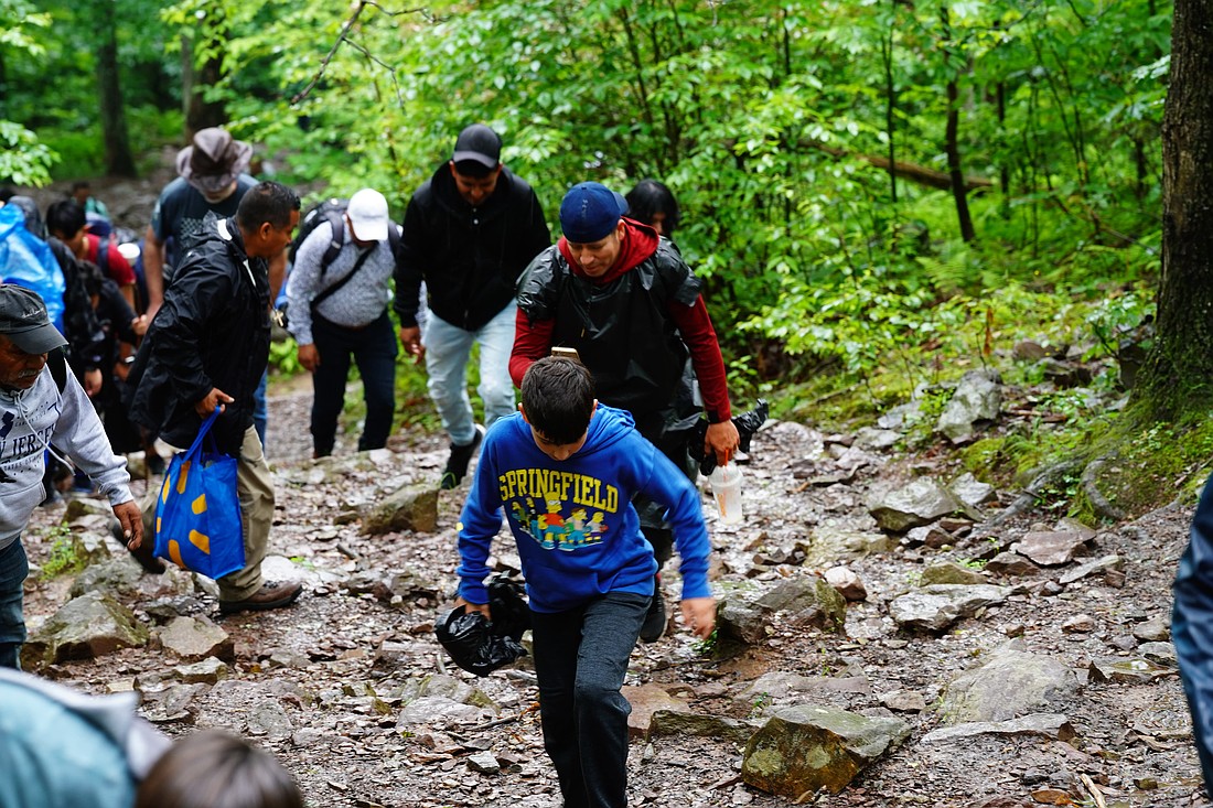 Mass on the Mountain participants navigate the trails during their June 14 hike. Jose Santiago photos