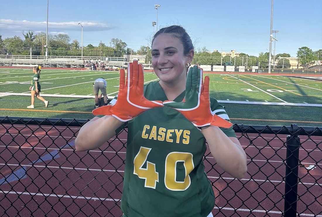 Kat Bauman displays the golden hands that allowed her to catch touchdown passes in 14 of the 16 flag football games she played in for Red Bank Catholic the past two seasons. Kat is following in the footsteps of brothers Kevin and Alex, who are Division I college players and former tight end standouts at RBC. Courtesy photo.