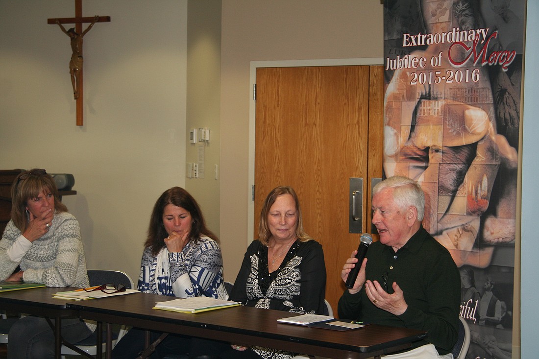 Jim Cassidy, right, participates in a panel discussion during a retreat for pastoral caregivers in this Monitor file photo. Mr. Cassidy, who retired as The Monitor's general manager and was a longtime member of Our Lady of Good Counsel Parish, died June 17. Funeral services will be June 21.