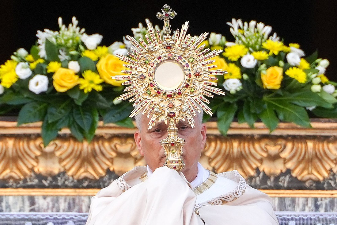 Pope Leo XVI raises the monstrance during Benediction after a Corpus Christi procession to Rome's Basilica of St. Mary Major June 22, 2025. (CNS photo/Lola Gomez)