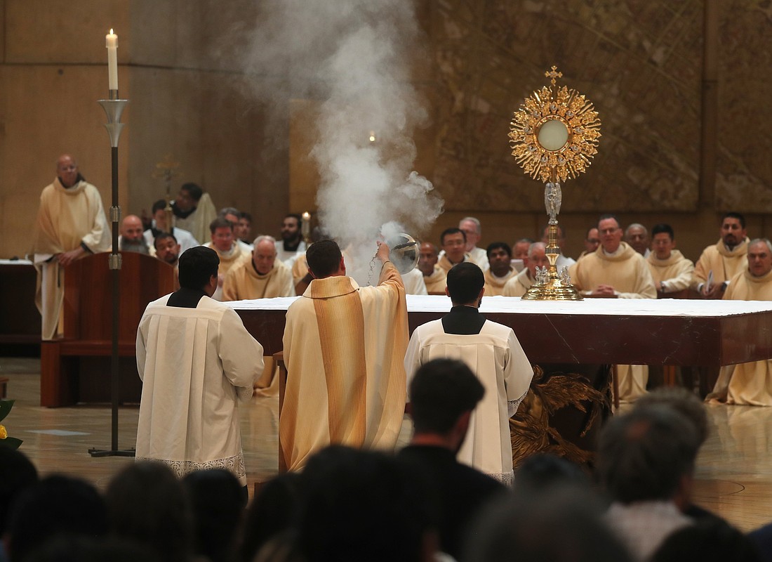 Bishop Andrew H. Cozzens of Crookston, Minn., chairman of the board of the National Eucharistic Congress Inc., swings a censer near the monstrance following a Mass for the feast of Corpus Christi at the Cathedral of Our Lady of the Angels in Los Angeles June 22, 2025, during the National Eucharistic Pilgrimage. (OSV News photo/Bob Roller)