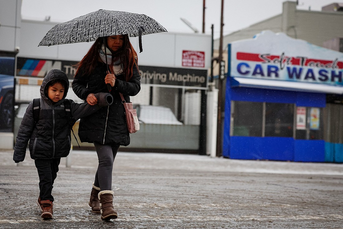 A mother and child walk to school during a morning snowfall in the Brooklyn borough of New York City, February 6, 2025. (OSV News photo/Brendan McDermid, Reuters)