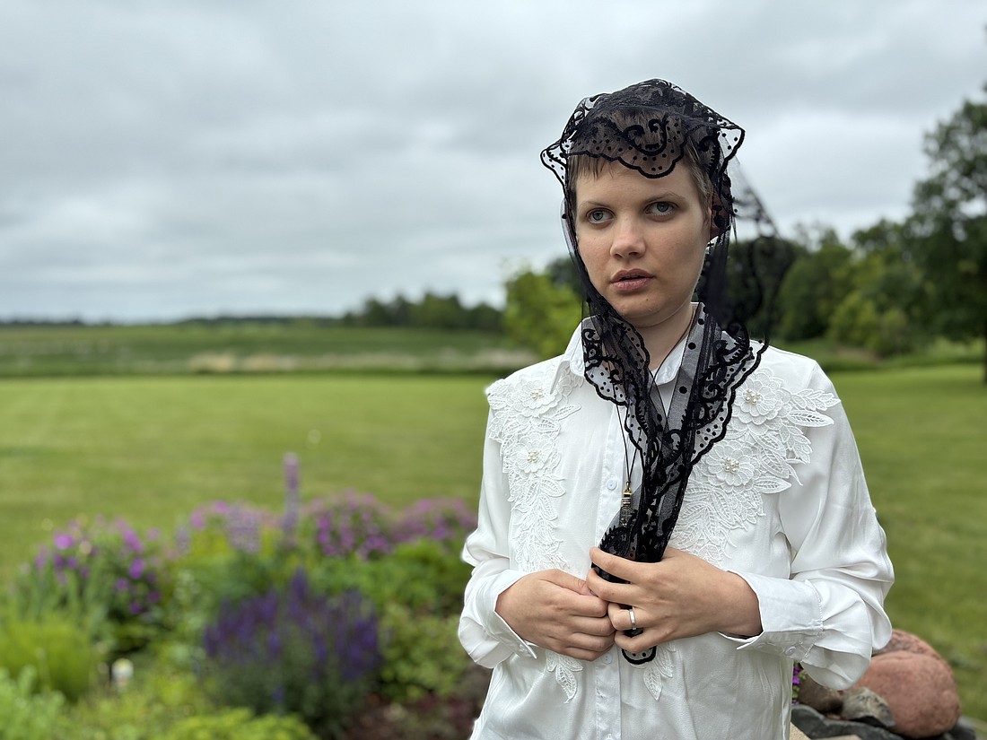 Claire Souilliart of Calais, France, stands in a garden June 14, 2025, near Stacy, Minn., after recounting her claims of two miraculous visits from Sister Annella Zervas, a Minnesota Benedictine whose cause for canonization may open soon, leading her to be cured of a blood disorder. (OSV News photo/Maria Wiering)