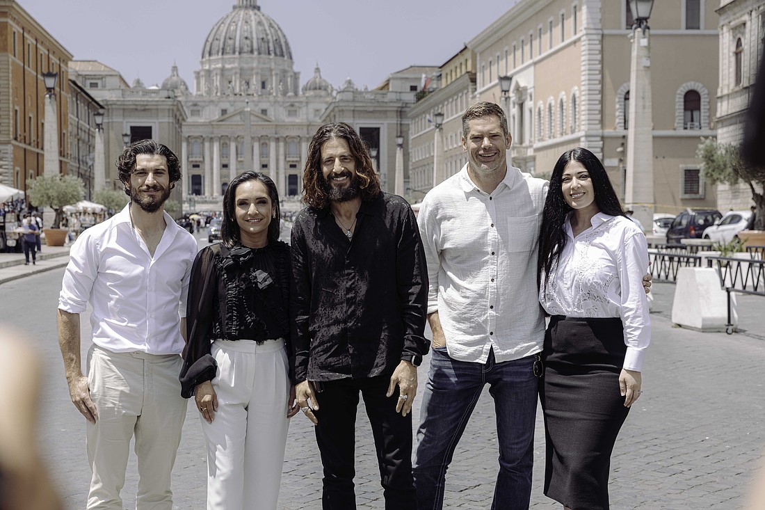 Members of the cast and crew of the series, "The Chosen," pose for a picture in front of St. Peter's Basilica in Rome June 23, 2025. From left to right are: Actors George Xanthis, who portrays John; Vanessa Benavente, who portrays Jesus' mother Mary; Jonathan Roumie, who portrays Jesus; director Dallas Jenkins; and actor Elizabeth Tabish, who portrays Mary Magdalene. While Season 5 already streamed in the U.S., it was being released in select countries worldwide in July. (CNS photo/courtesy TheChosen.tv)