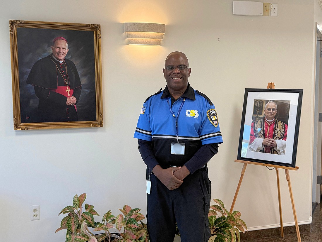 Ron Williams smiles in the entrance of the Chancery in Lawrenceville June 25. Staff photo