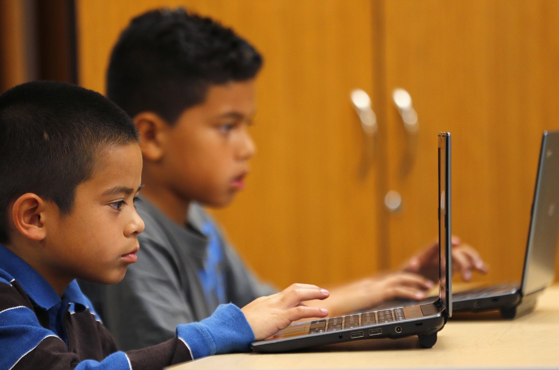 Fourth-grade students are pictured in a file photo working on laptop computers at Monarch School in San Diego. An analysis from Pew Research Center published June 23, 2025, showed 57% of U.S. adults say they favor allowing public school teachers to lead their classes in prayers referencing God, while 52% support teachers leading prayers "that refer to Jesus." (OSV News photo/Mike Blake, Reuters)