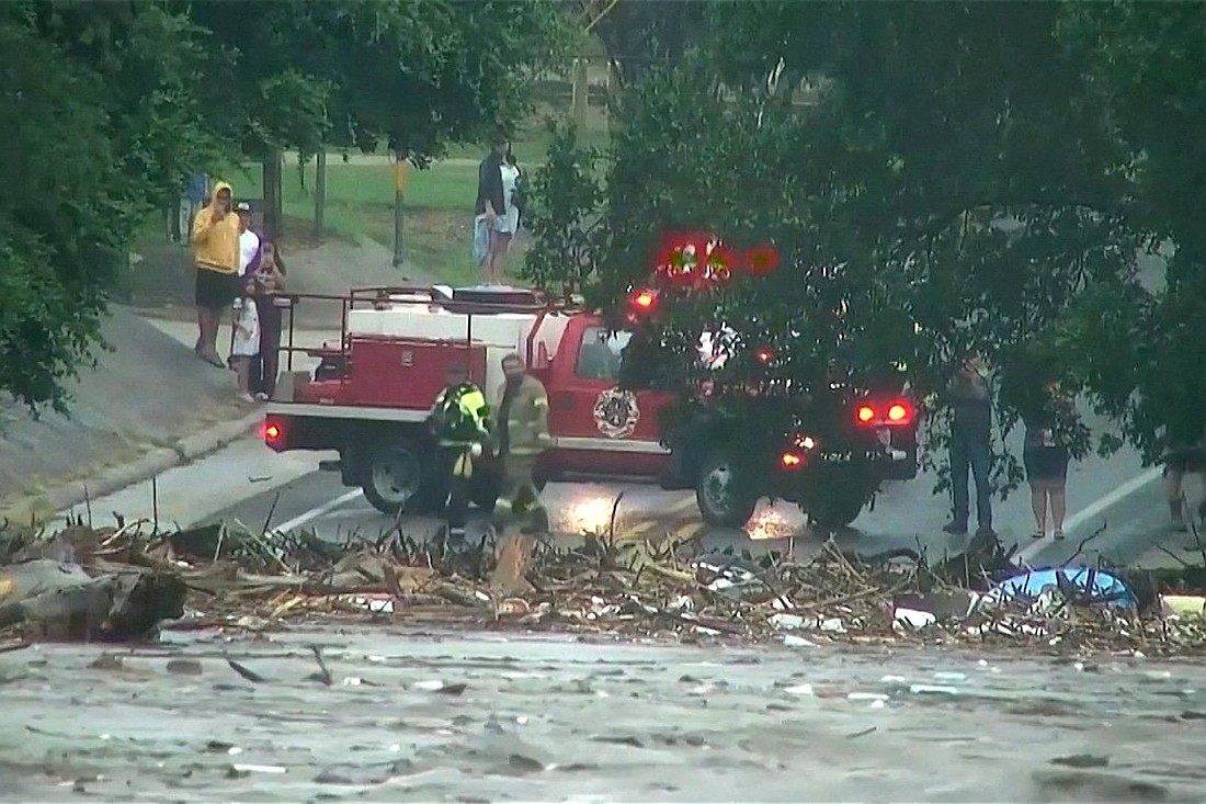 First responders survey rising flood waters of the Guadalupe River after flash flooding in Kerr County, Texas, U.S. July 4, 2025. (OSV News photo/Affiliate KSAT, via Reuters) ..Editors: Photo is a still image from video.