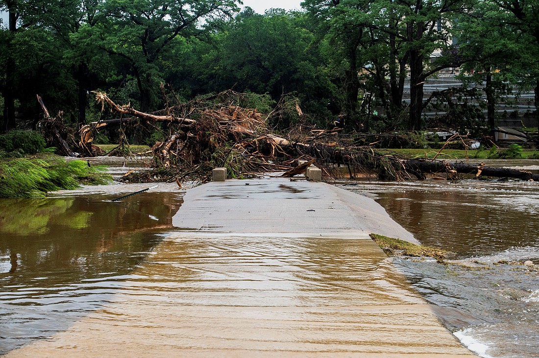 A walkway is blocked by fallen trees following deadly flooding in Kerrville, Texas, on July 5, 2025. (OSV News photo/Sergio Flores, via Reuters)