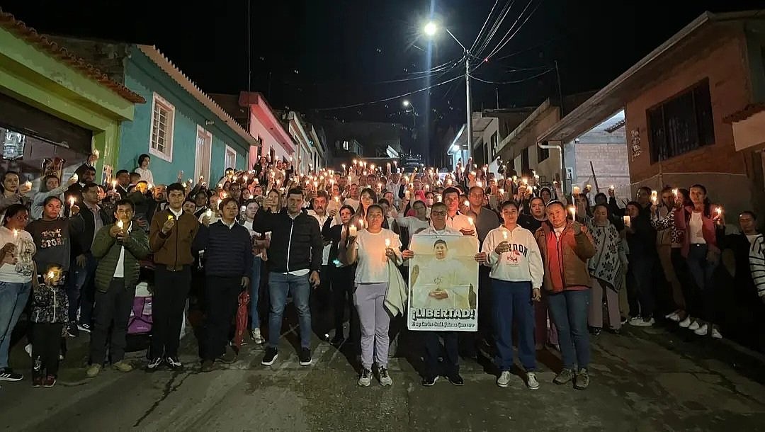 Protesters join a nightly march in Viotá, Colombia, June 26, 2025, with hundreds of residents carrying candles and banners bearing photos of Father Carlos Jaimes Guerrero. For almost three weeks, the Colombian authorities have been searching for the 30-year-old Augustinian friar, who went missing June 17, and they still had not identified potential reasons for his disappearance. (OSV News photo/local government Facebook page)(OSV News photo/local government Facebook page)