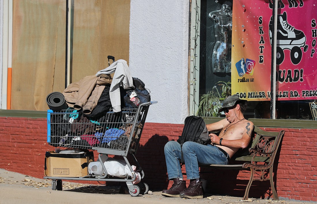 A homeless man sits with his belongings in Prescott, Ariz., Dec. 9, 2024. (OSV News photo/Bob Roller)