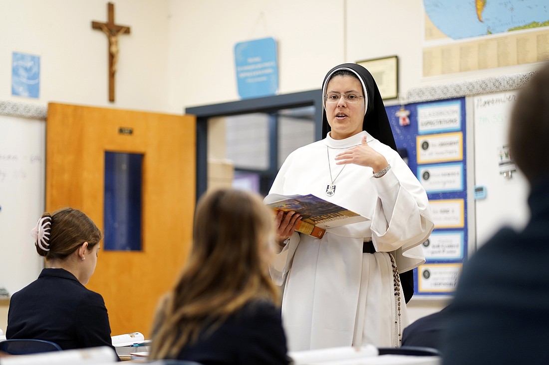 Sister Agnes Maria, a member of the Dominican Sisters of Mary, Mother of the Eucharist, is seen teaching a seventh-grade class on ancient civilization at St. Mary's Middle School in Manhasset, N.Y., Nov. 15, 2023. (OSV News photo/Gregory A. Shemitz)