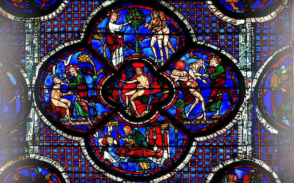 The stained glass image shows the Good Samaritan parable at cathedral of Notre Dame, Chartres. Getty image
