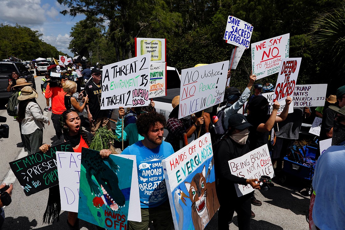 Protesters flank an entrance road at a temporary migrant detention center nicknamed "Alligator Alcatraz" in Ochopee, Fla., July 1, 2025, the day U.S. President Donald Trump visited the facility. (OSV News photo/Octavio Jones, Reuters)