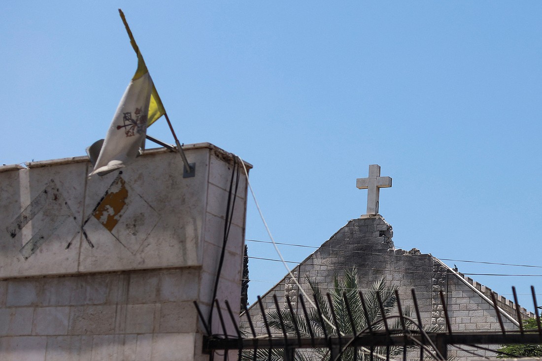 The Vatican City flag flies July 18, 2025, at Holy Family Church in Gaza City which was hit in an Israeli strike July 17. (OSV News photo/Khamis Al-Rifi, Reuters)