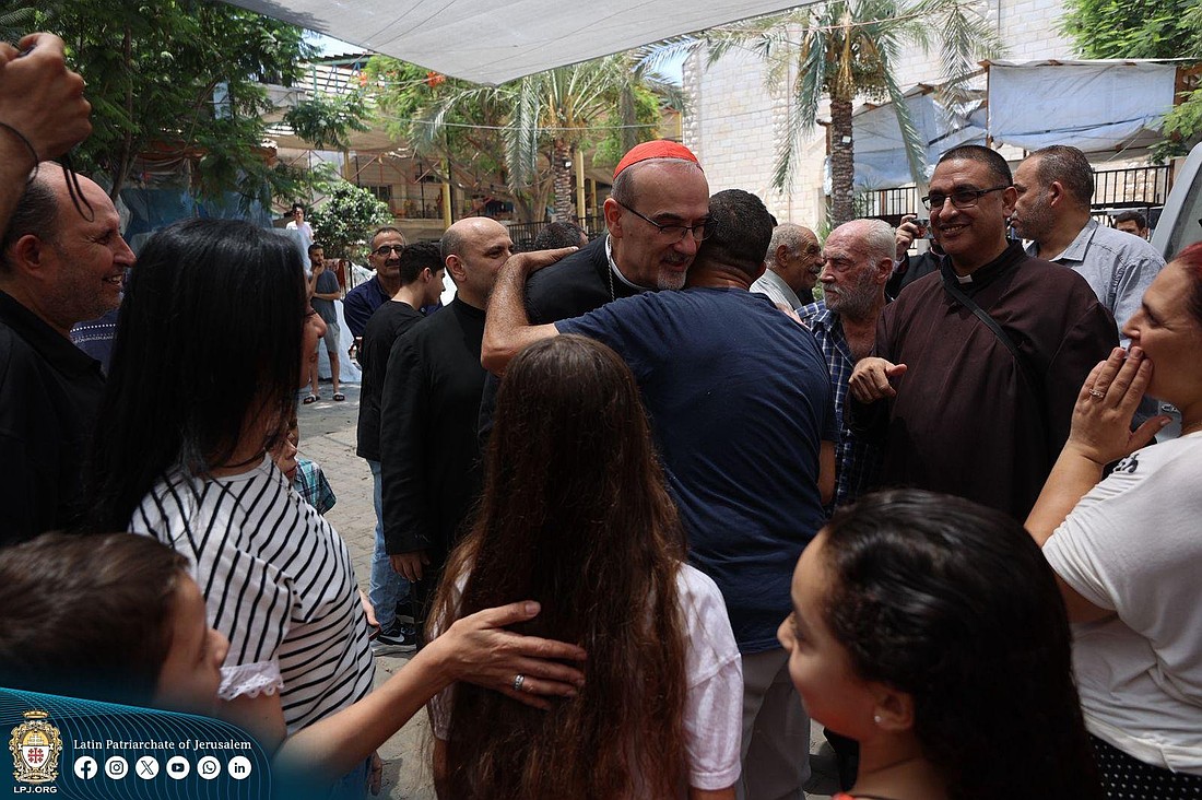 Latin Patriarch of Jerusalem Cardinal Pierbattista Pizzaballa, who entered the Gaza Strip with Greek Orthodox Patriarch of Jerusalem Theophilos III, comforted and greeted parishioners of Holy Family Parish in Gaza City July 18, 2025. The patriarchs offered support, closeness and prayers following the July 17 Israeli military strike on the Holy Family compound, which killed three people and wounded 10, including parish pastor Father Gabriel Romanelli. (OSV News photo/courtesy Latin Patriarchate of Jerusalem)