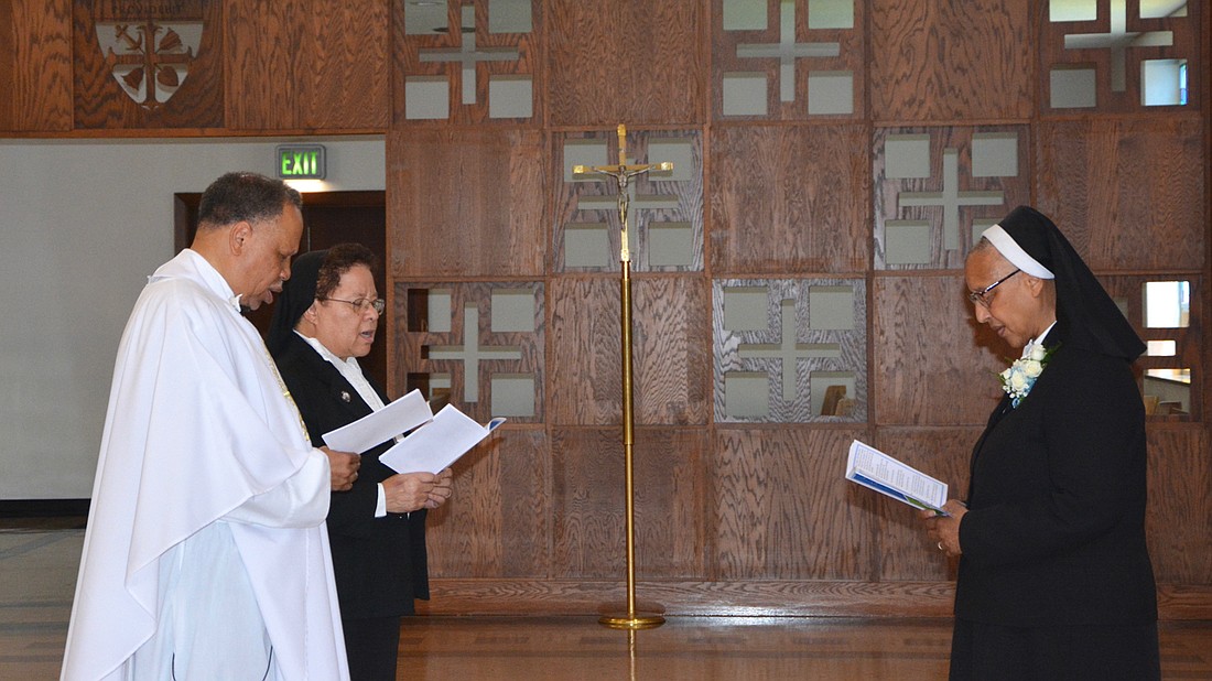 Sister Marcia Hall, right, is installed as the 21st Superior General of the Oblate Sisters of Providence with Josephite Father Anthony Bozeman presiding. Next to Father Bozeman is Sister Rita Michelle Proctor, Sister Marcia’s predecessor. Courtesy photo.