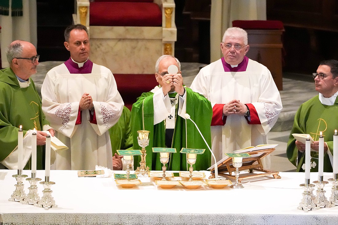 Pope Leo XIV elevates the Eucharist during Mass in the Cathedral of St. Pancras Martyr in Albano Laziale, southeast of Rome, July 20, 2025. (CNS photo/Lola Gomez)