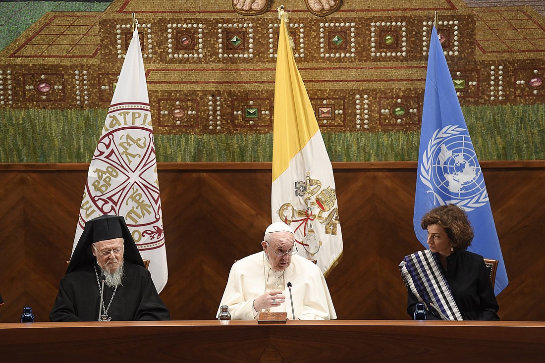 Ecumenical Patriarch Bartholomew of Constantinople, Pope Francis, and Audrey Azoulay, director-general of UNESCO, attend a meeting at Rome's Pontifical Lateran University Oct. 7, 2021. (CNS photo/Vatican Media)