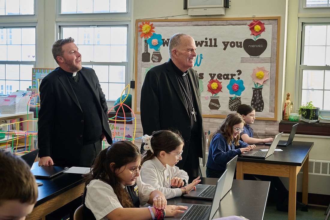 Bishop David M. O’Connell, C.M., and Father Chris Dayton, pastor, visit a fourth grade technology class in St. Paul School, Princeton, during Catholic Schools Week 2025. Mike Ehrmann photo