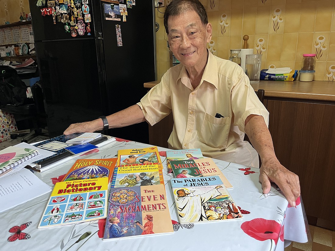Andrew Goh, an 88-year-old catechist, poses for a photo at his home in Singapore July 2, 2025. Goh uses children's books to teach the Catholic catechism to the elderly who want to join the church. (OSV News photo/Christopher Khoo)