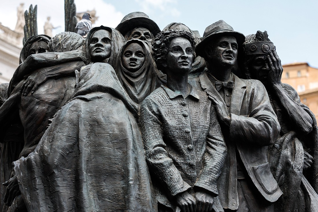 A detail is seen of "Angels Unawares," a sculpture by Canadian Timothy Schmalz in St. Peter's Square at the Vatican, June 3, 2024. The sculpture depicts a boat with 140 figures of migrants from various historical periods and various nations. (CNS photo/Lola Gomez)