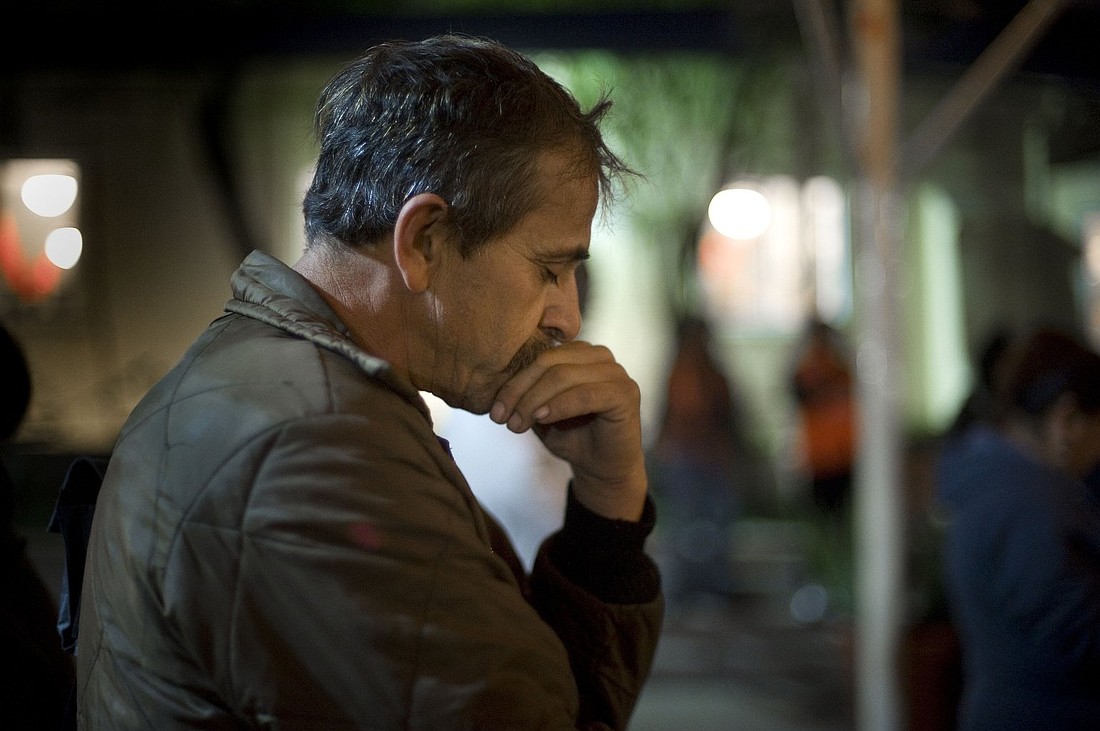 A homeless migrant from Mexico is pictured in a file photo praying at a shelter in Los Angeles. Archbishop José H. Gomez joined by LA business leaders, unveiled a new fund July 23, 2025, that is aimed at helping families affected by recent immigration raids. (OSV News photo photo/David Maung)