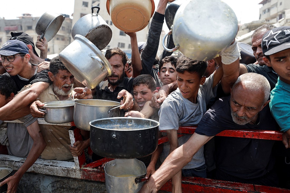 Palestinians gather to receive food from a charity kitchen amid a hunger crisis in the central Gaza Strip July 29, 2025. (OSV News photo/Hatem Khaled, Reuters)