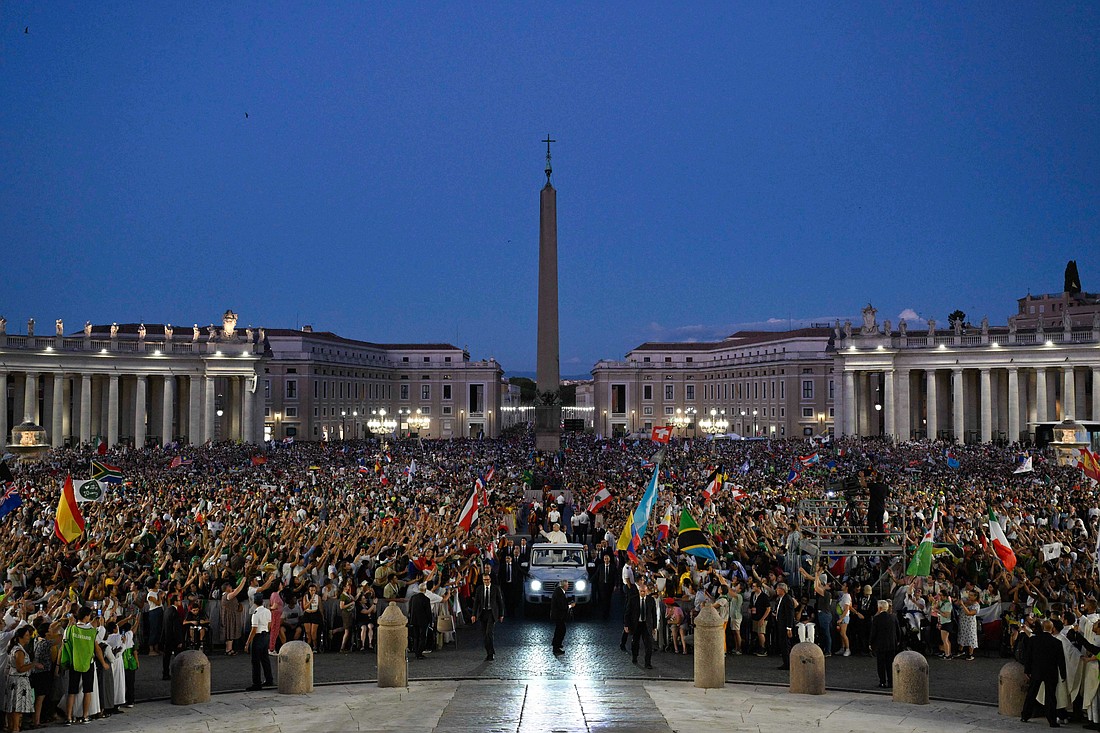 Pope Leo XIV greets visitors and pilgrims from the popemobile as he rides through St. Peter’s Square at the conclusion of an evening Mass celebrated by Archbishop Rino Fisichella, pro-prefect of the Dicastery for Evanglization, as part of the Jubilee of Youth at the Vatican July 29, 2025. (CNS photo/Vatican Media)