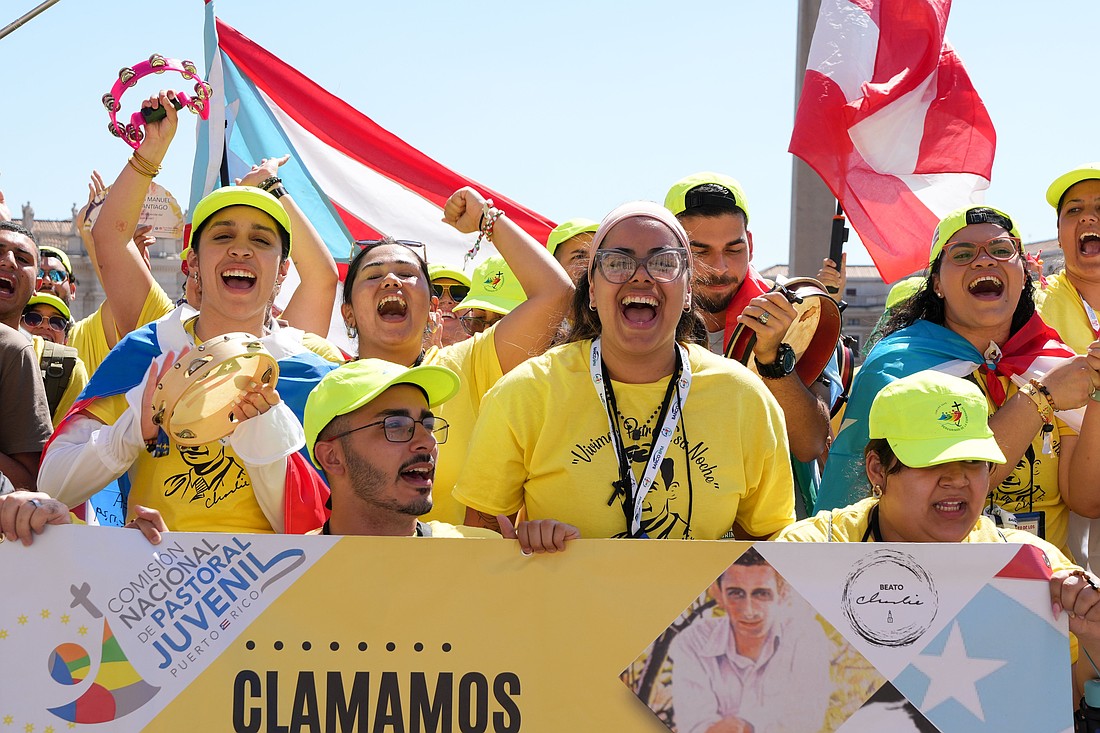 Members of the Comisión Nacional de Pastoral Juvenil Puerto Rico sing in celebration at the conclusion of Pope Leo XIV’s weekly general audience in St. Peter’s Square at the Vatican July 30, 2025. (CNS photo/Lola Gomez)