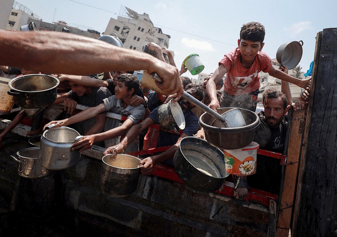 Palestinians gather to receive food from a charity kitchen amid a hunger crisis in the central Gaza Strip July 29, 2025. Despite daunting odds, Catholic Relief Services and its on-the-ground partners have managed to deliver aid to 1.7 million people in Gaza since 2023, according to new data. (OSV News photo/Hatem Khaled, Reuters)