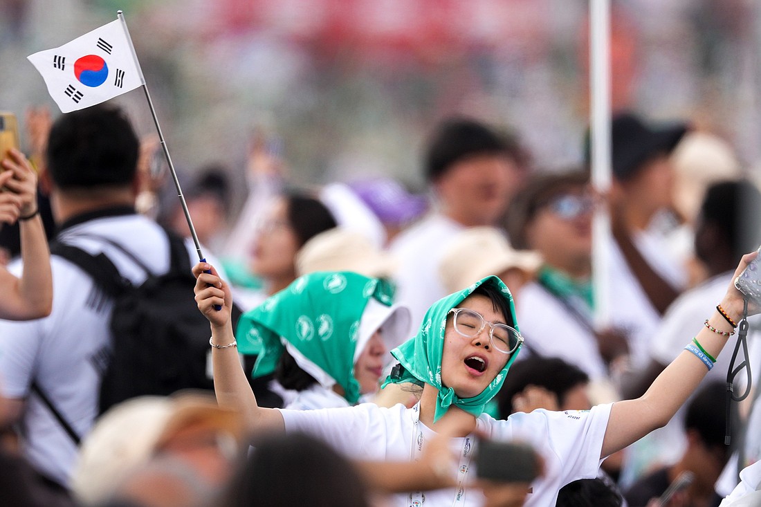 A pilgrim waves a South Korean flag during Mass closing the Jubilee of Youth in Rome’s Tor Vergata neighborhood Aug. 3, 2025. (CNS photo/Lola Gomez)