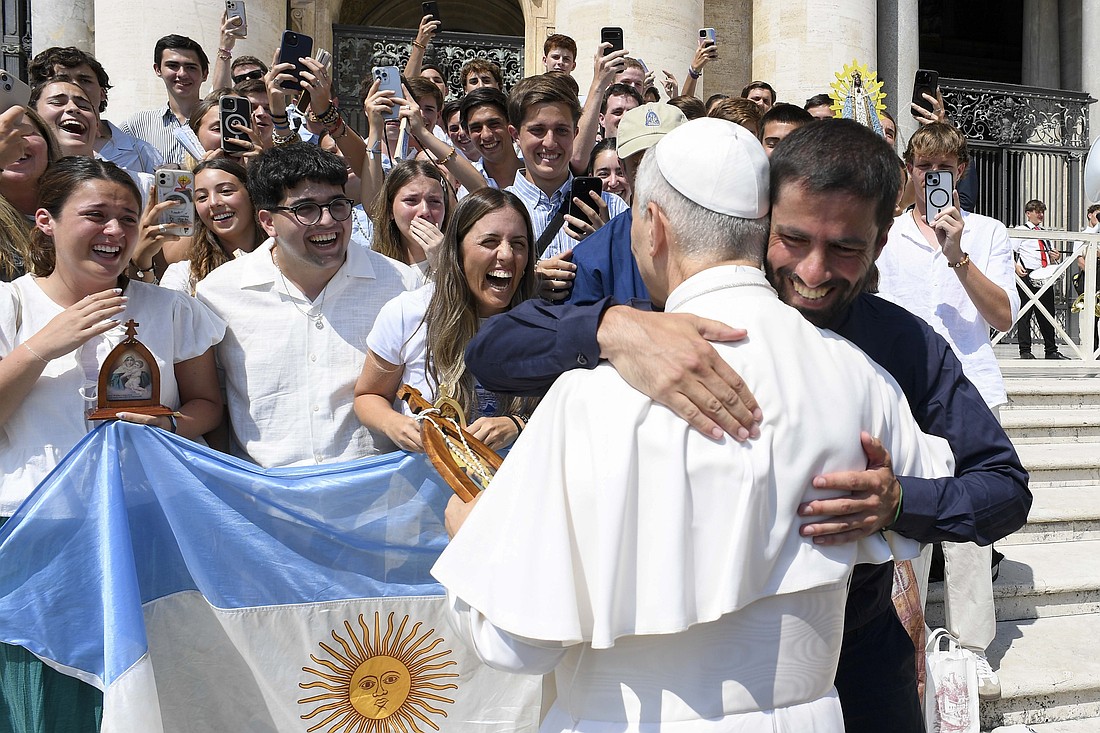 Pope Leo XIV hugs a pilgrim from Argentina after his weekly general audience Aug. 6, 2025, in St. Peter's Square at the Vatican. (CNS photo/Vatican Media)