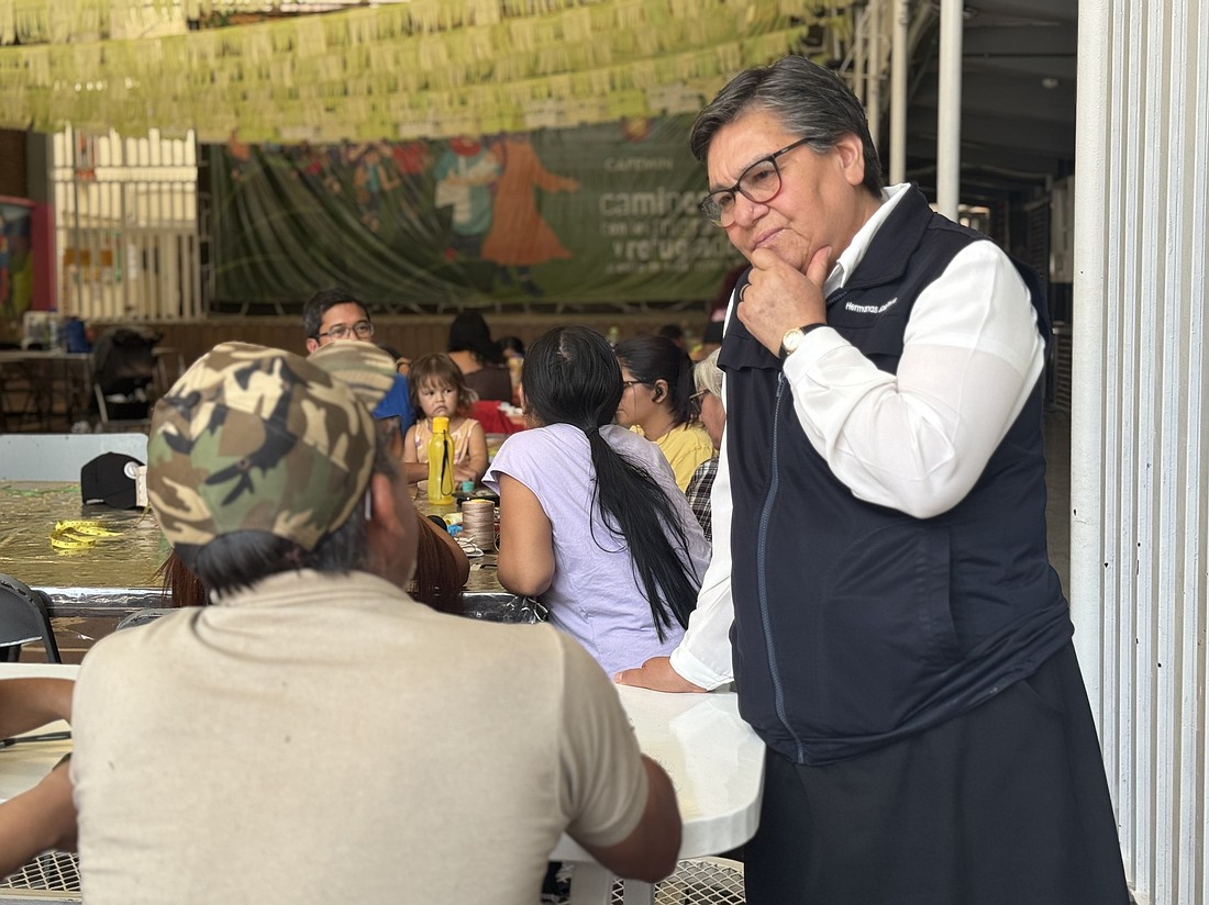Sister María Magdalena Silva Rentería listens to a man looking for work April 1, 2025, at the CAFEMIN shelter in Mexico City. The shelter, run by the Josephine sisters, is among those scrambling to help migrants who abandoned their journey north to the U.S.-Mexico border and are trying to travel south, back to their country of origin, amid Mexico's restrictions on migrants' movements. (OSV News photo/Rhina Guidos, Global Sisters Report)