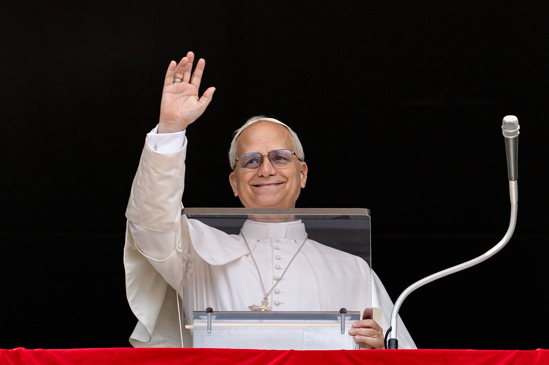 Pope Leo XIV greets people gathered in St. Peter’s Square for the recitation of the Angelus at the Vatican Aug. 10, 2025 (CNS photo/Vatican Media)