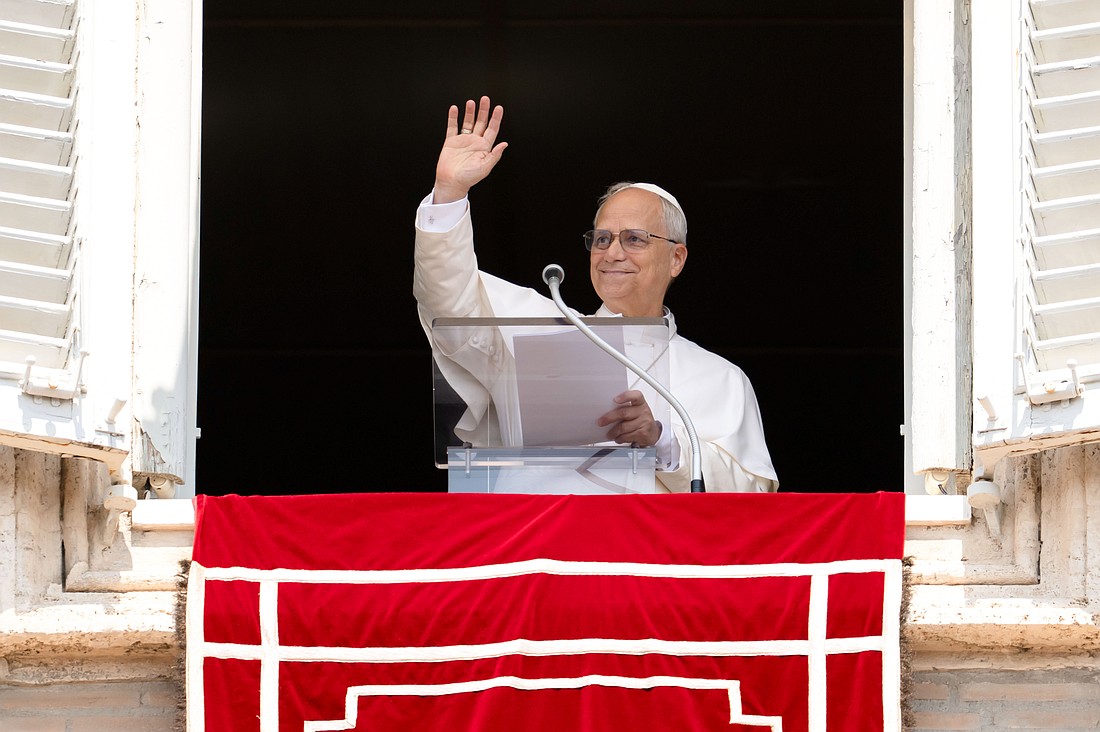 Pope Leo XIV greets people gathered in St. Peter’s Square at the Vatican for the recitation of the Angelus prayer Aug. 10, 2025. (CNS photo/Vatican Media)