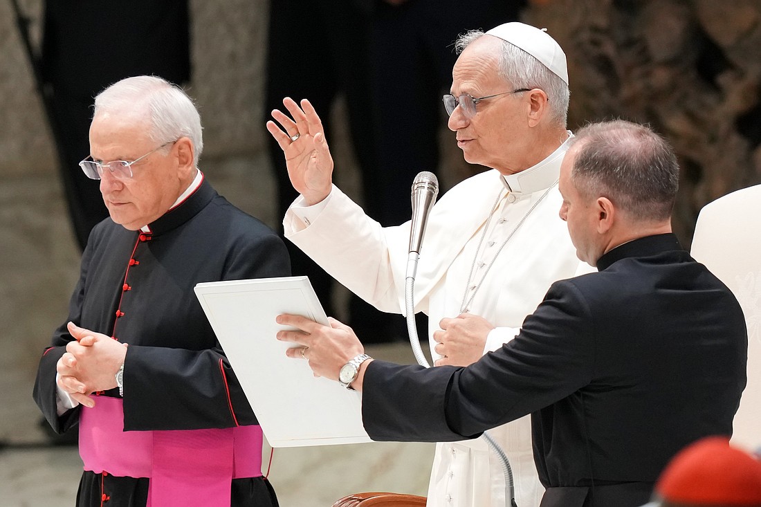 Pope Francis gives his blessing at the end of his weekly general audience in the Paul VI Audience Hall at the Vatican Aug. 13, 2025. (CNS photo/Lola Gomez)