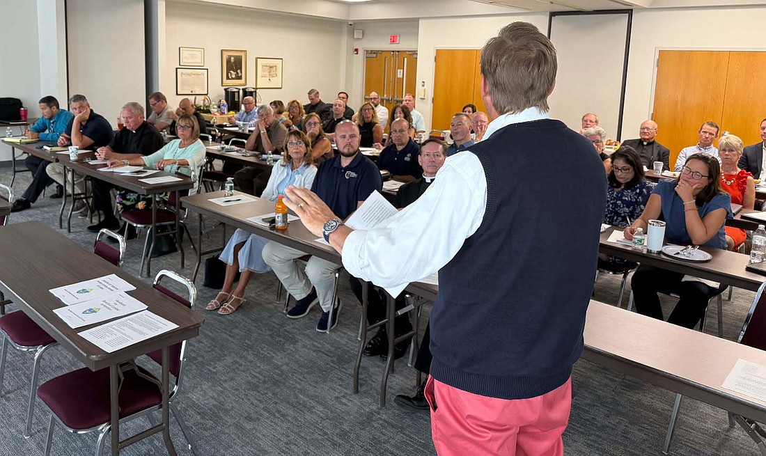 Dr. Vincent de Paul Schmidt, diocesan superintendent of Catholic education, addresses the gathering of pastors and principals during the Aug. 13 retreat hosted by the diocesan Department of Catholic Schools. Courtesy photo