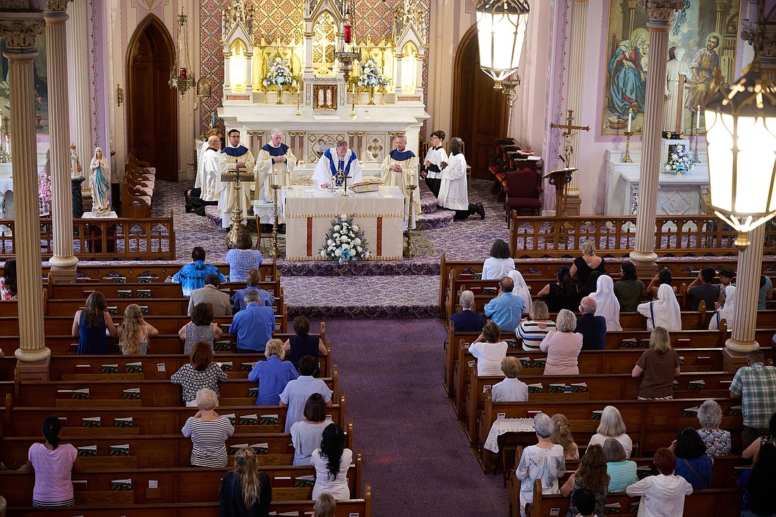 Bishop O'Connell was principal celebrant of a Mass for the Solemnity of the Assumption of the Blessed Virgin Mary Aug. 15 in St. Michael Church, West End. After the Mass, the Bishop led the faithful in a procession to the beach where he blessed the ocean. Mike Ehrmann photo