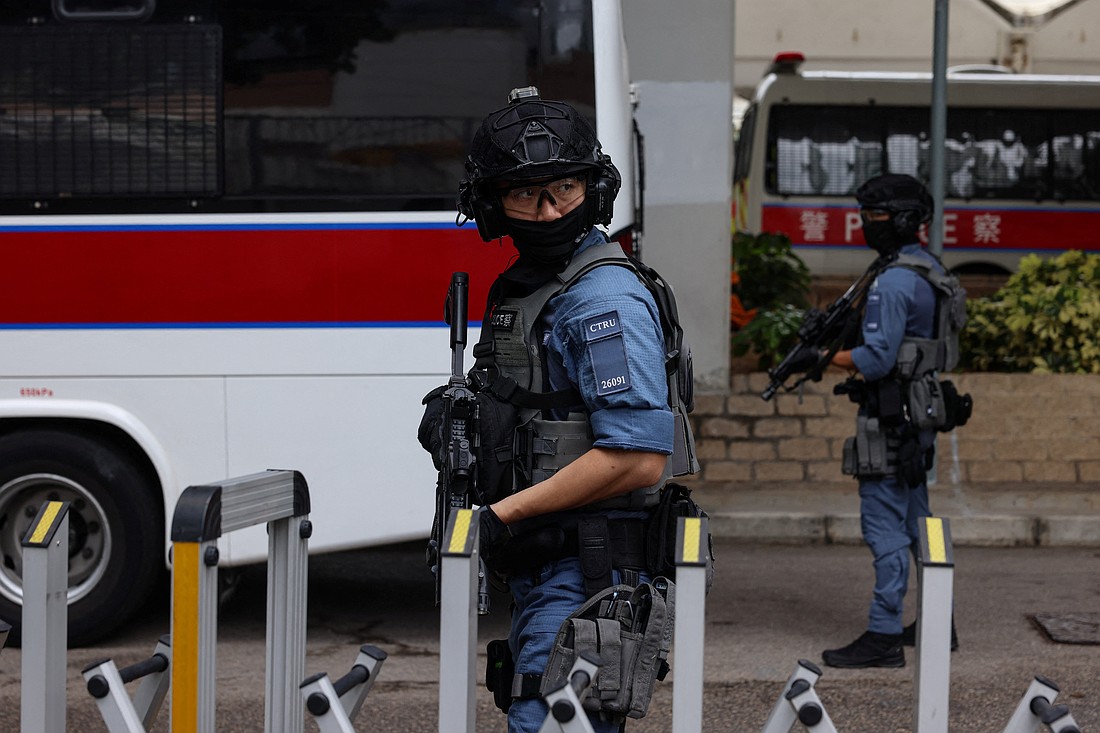 Police officers stand guard outside the West Kowloon Magistrates' Courts building in Hong Kong Aug. 15, 2025, for the closing submissions in the national security collusion trial of Jimmy Lai, a Catholic and founder of the now-defunct pro-democracy newspaper Apple Daily. At the start of final submissions in his landmark trial on Aug. 18, Lai was provided with medication and a heart monitor after health concerns had delayed proceedings the previous week. (OSV News photo/Lam Yik, Reuters)
