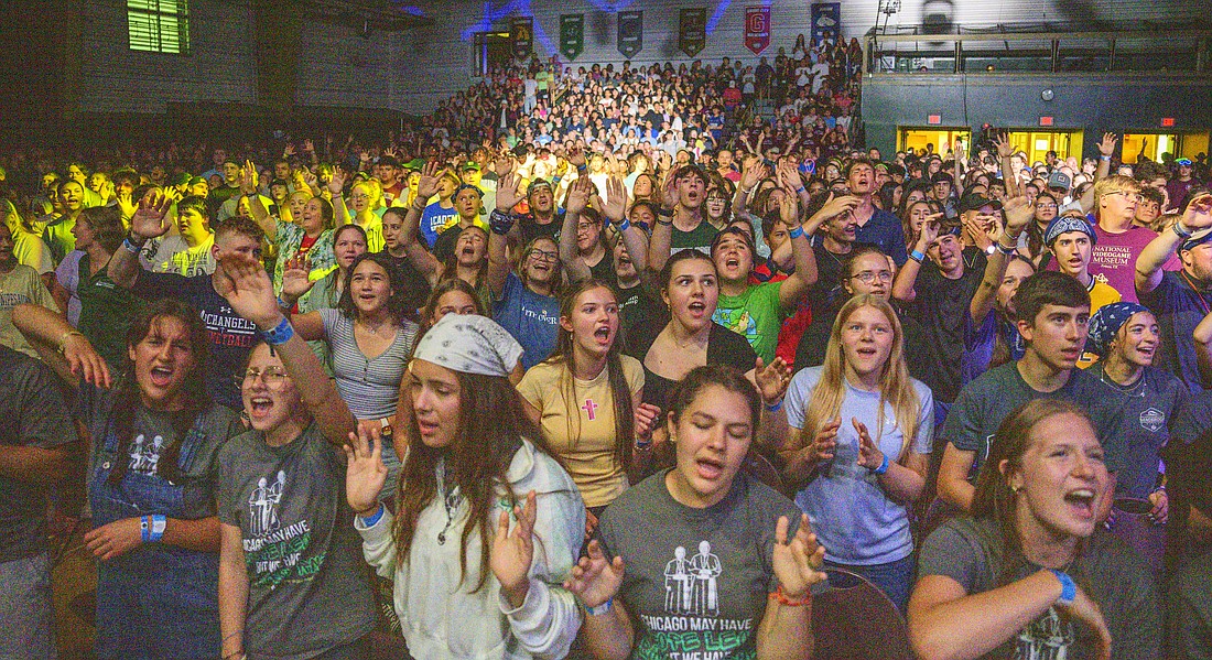 Thousands of teens inside pray inside Finnegan Fieldhouse at Franciscan University of Steubenville in Ohio, during one of the university’s numerous 2024 Summer Youth Conferences. (OSV News photo/courtesy Franciscan University of Steubenville)