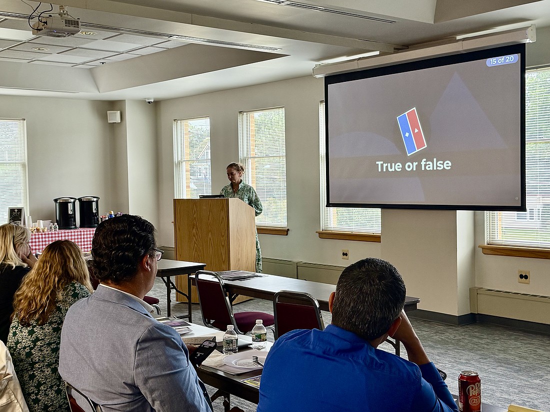Principals take part in a Kahoot quiz on school funding, led by Bonnie Milecki, assistant superintendent for school development and operations, during the Diocese of Trenton’s back-to-school meeting Aug. 18 at the Chancery in Lawrenceville.